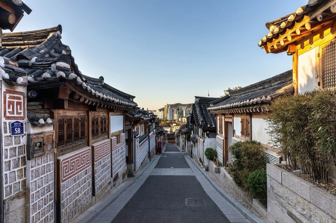 A residential lane in Bukchon lined with tile-roofed hanok houses