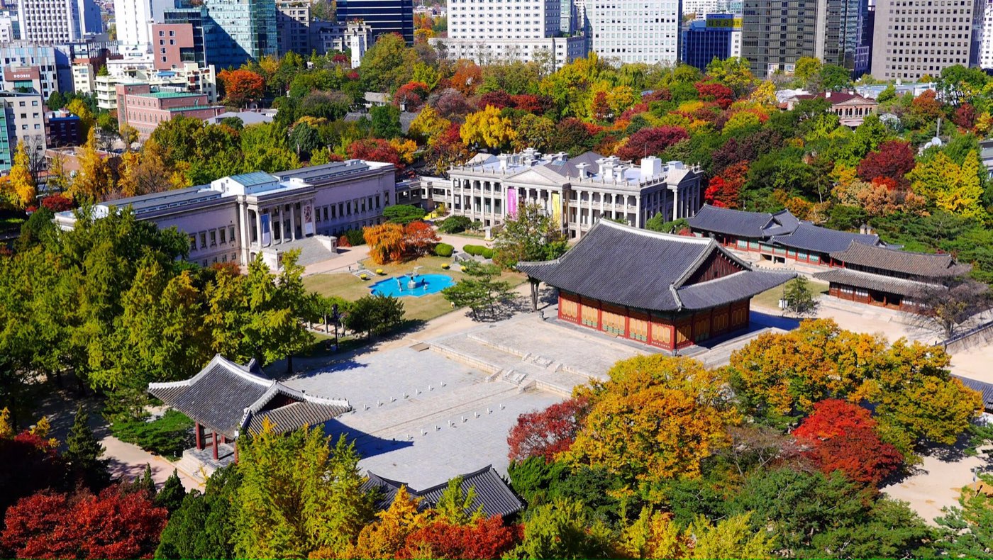 Deoksugung Palace from above in autumn, with Seokjojeon and central Seoul around it