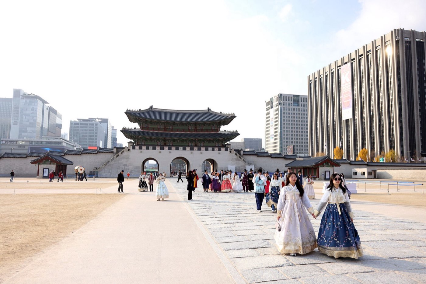 Visitors wearing hanbok in the forecourt of Gyeongbokgung Palace