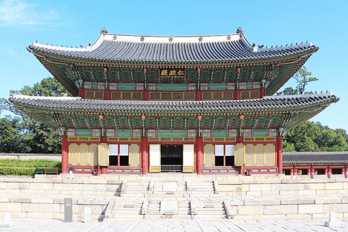Injeongjeon, the two-storey throne hall of Changdeokgung, rising above its stone platform and forecourt.
