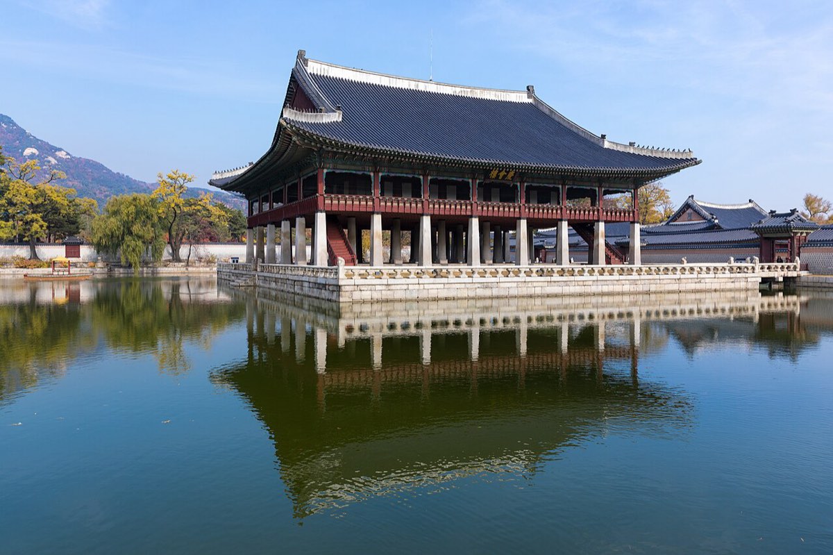 Gyeonghoeru, the royal banquet pavilion raised on stone pillars, reflected in its square pond at Gyeongbokgung.