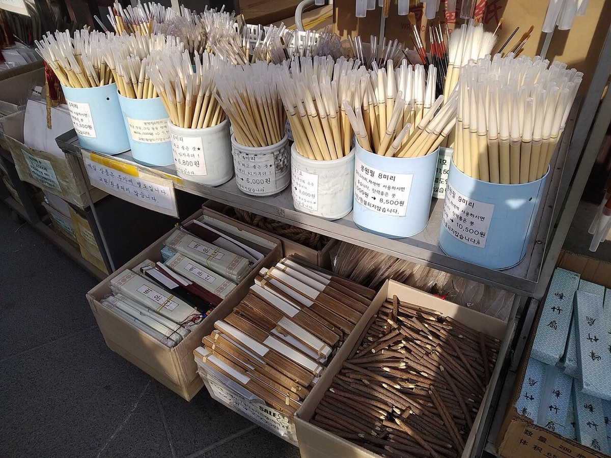 Calligraphy brushes and blank fans for painting on sale at a shop in Insadong, Seoul.
