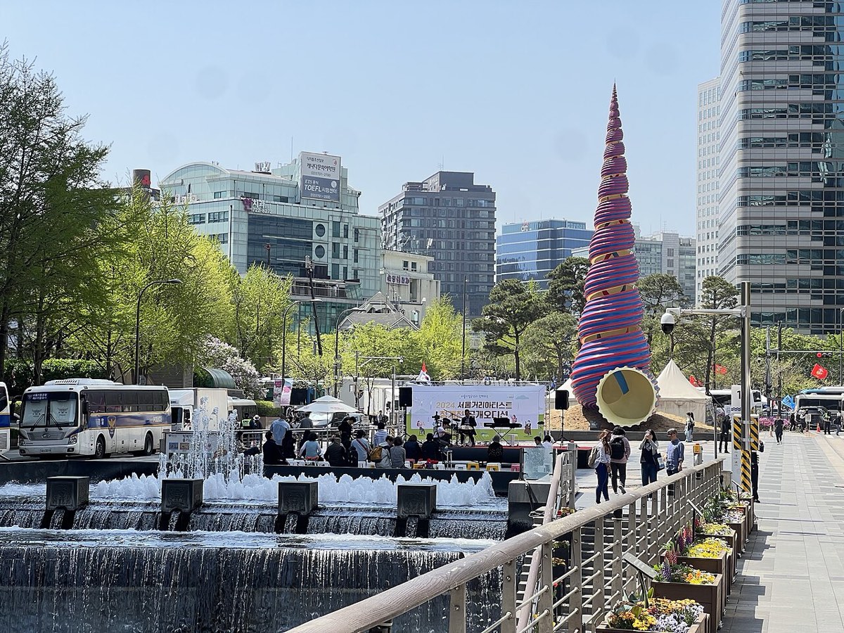 Cheonggye Plaza in central Seoul, where the restored Cheonggyecheon stream begins below the city towers.