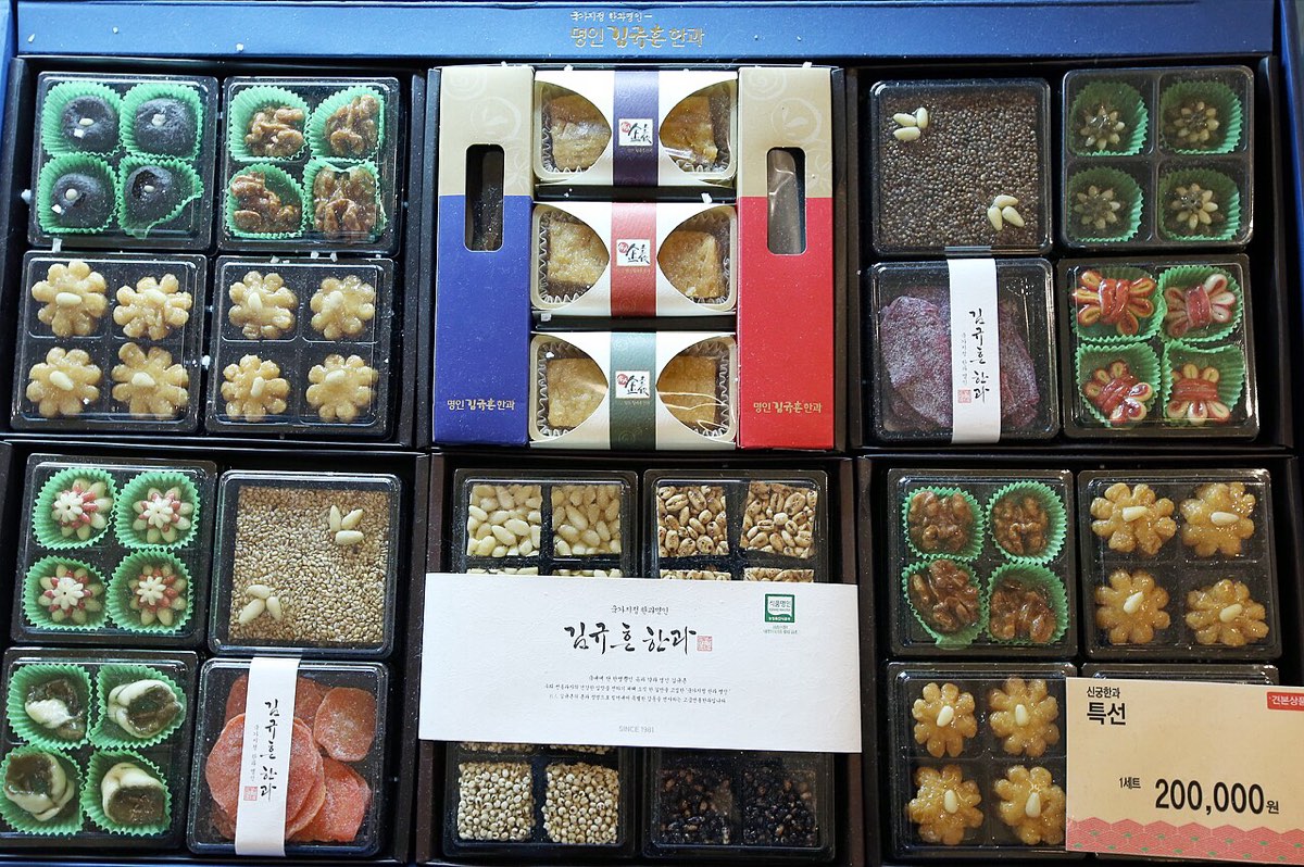 Boxed food gift sets with price tags on sale at a Seoul department store before Seollal.