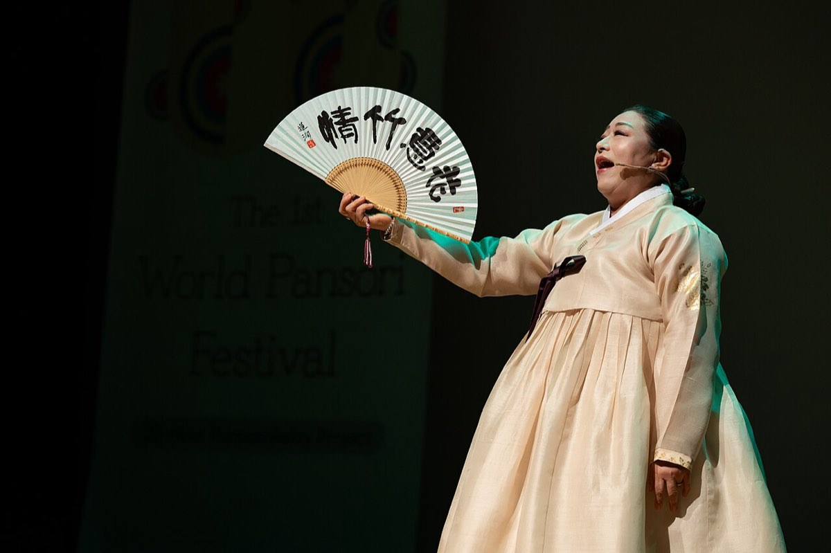 A pansori singer performs with a folding fan at the World Pansori Festival at Seoul Namsan Gugakdang in 2023.
