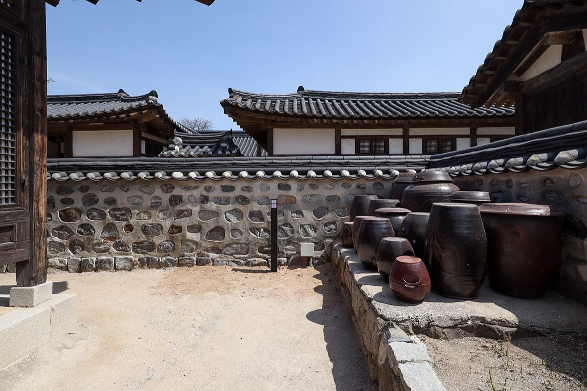 Onggi storage jars in the courtyard of one of the relocated late-Joseon houses at Namsangol Hanok Village.