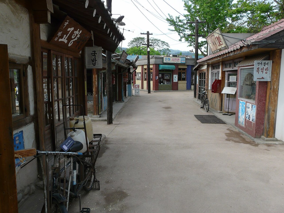 Old shopfronts recreating a 1970s Seoul street in the outdoor grounds of the National Folk Museum of Korea.