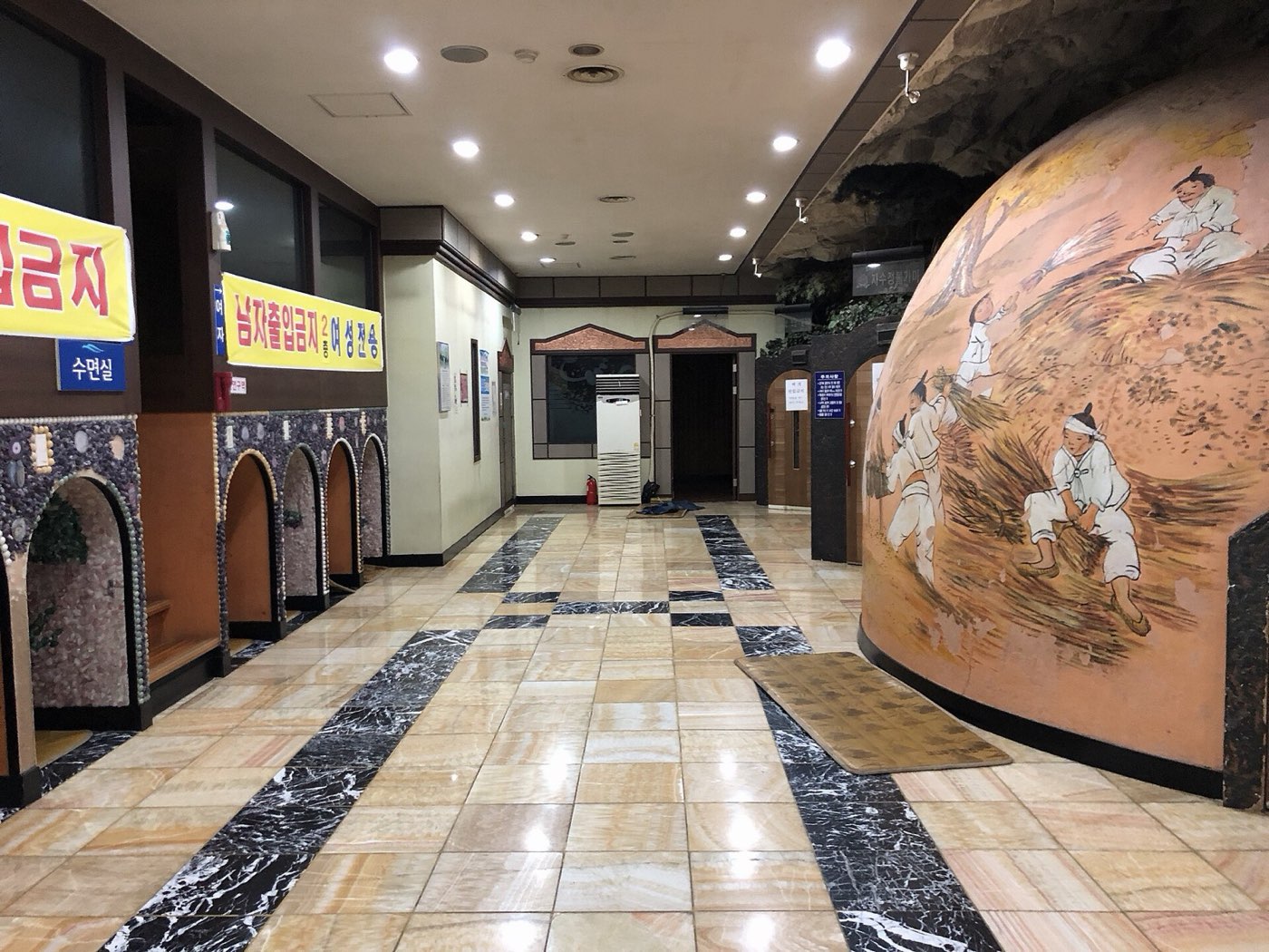 The domed entrance of a kiln-style sauna room (bulgama) inside a Korean jjimjilbang
