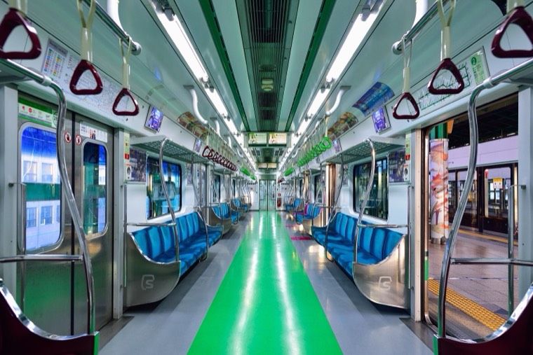 Inside a Seoul Metro subway car, with priority seats at the end of the carriage
